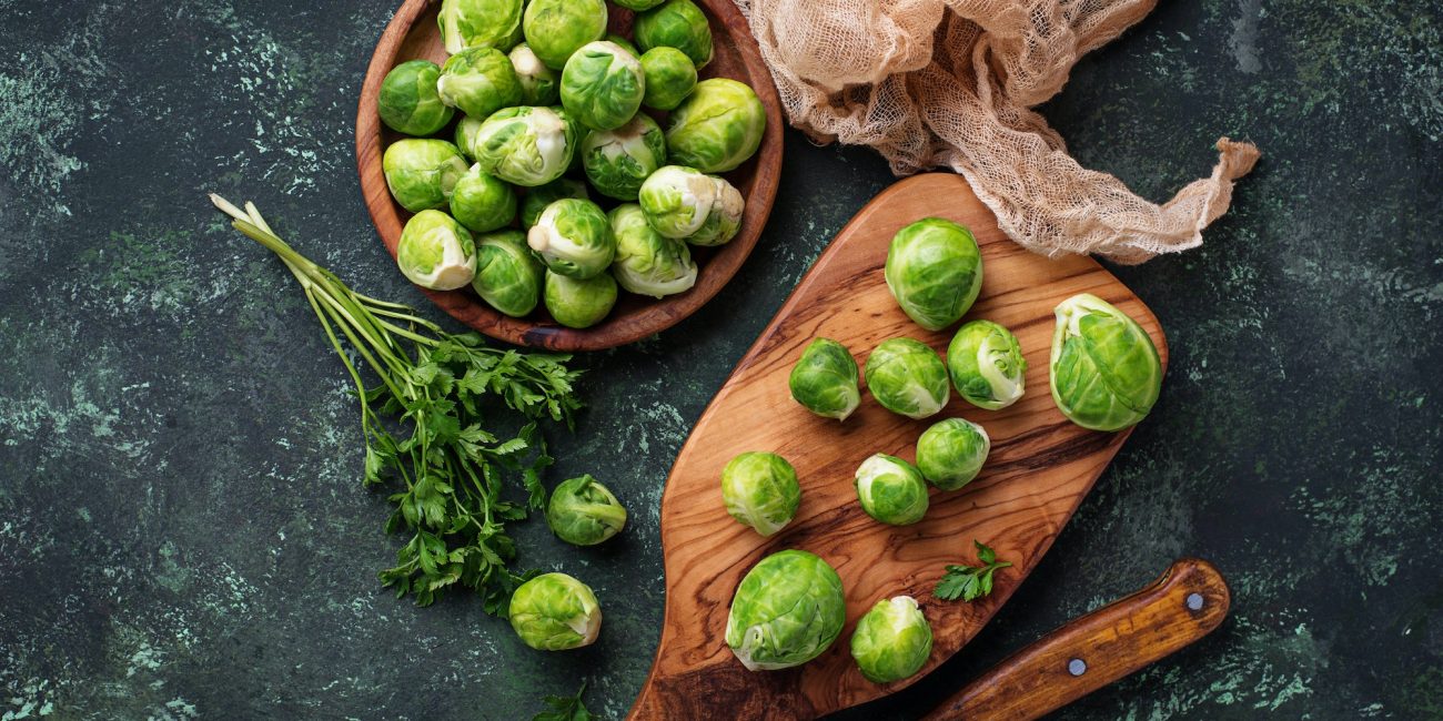 Brussels sprouts on green concrete background